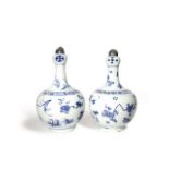 A NEAR PAIR OF CHINESE BLUE AND WHITE GARLIC-MOUTH VASES TRANSITIONAL C.1640 Each with an ovoid body