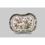 A CHINESE FAMILLE VERTE KIDNEY-SHAPED DISH KANGXI 1662-1722 Painted with a bird perched on a