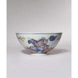 A CHINESE UNDERGLAZE BLUE AND RED 'MYTHICAL CREATURES' BOWL SIX CHARACTER KANGXI MARK AND POSSIBLY