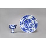 A CHINESE BLUE AND WHITE PLATE AND A STEM BOWL KANGXI 1662-1722 The plate decorated with a bird