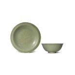 A CHINESE CELADON BOWL AND DISH MING DYNASTY The interior of the bowl moulded with floral and