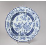 A CHINESE BLUE AND WHITE SHALLOW BASIN 18TH CENTURY Painted with a pheasant in flight above a