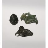THREE SMALL ORDOS BRONZE PLAQUES C.6TH CENTURY BC AND LATER One cast as a stylised bird, another the