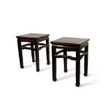 A PAIR OF CHINESE HARDWOOD STANDS QING DYNASTY Each with a plain panelled top supported on four