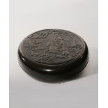 A CHINESE HARDWOOD CIRCULAR BOX AND COVER 19TH CENTURY The cover carved in low relief with a lady