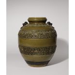 A CHINESE TEADUST GLAZED ARCHAISTIC VASE LATE QING DYNASTY/REPUBLIC PERIOD The ovoid body carved