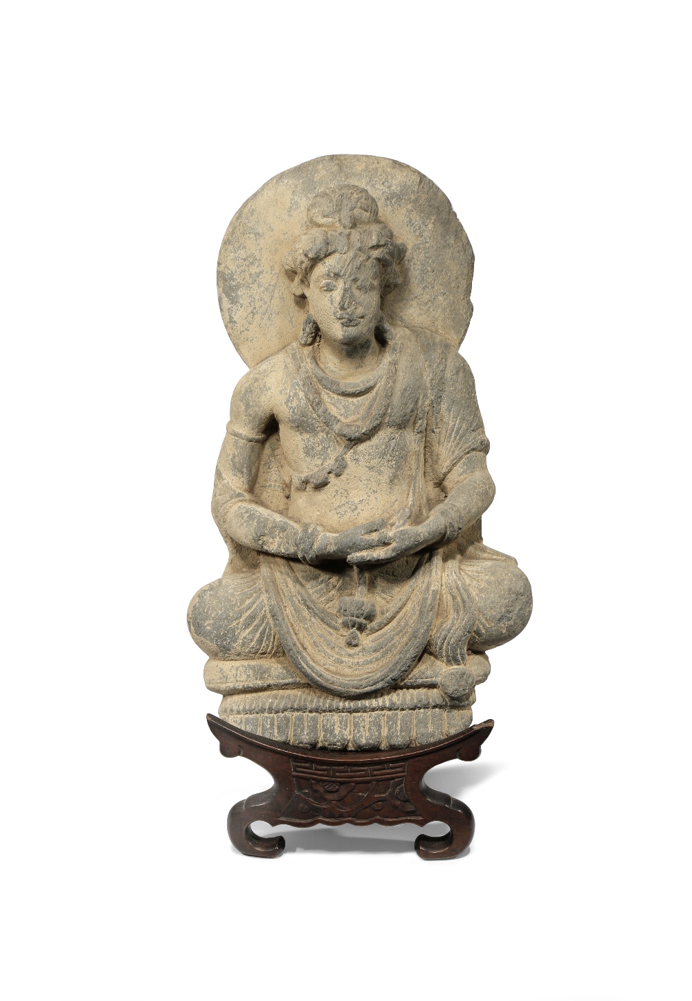 A GANDHARAN GREY SCHIST FIGURE OF BUDDHA C.2ND CENTURY AD Depicted seated in a meditative pose on