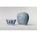 A CHINESE BLUE AND WHITE BOWL AND VASE KANGXI 1662-1722 The bowl with sprays of various flowers