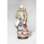 A LARGE CHINESE FAMILLE ROSE FIGURE OF SHOULAO 20TH CENTURY The God of Longevity stands on a