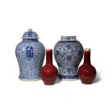 TWO CHINESE BLUE AND WHITE BALUSTER VASES AND A PAIR OF LANGYAO BOTTLE VASES 19TH CENTURY One