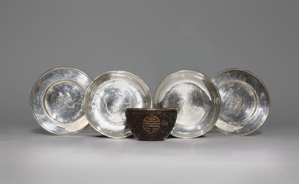 FOUR CHINESE SILVER DISHES AND A COCONUT CUP QING DYNASTY AND LATER The cup carved with three shou