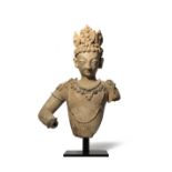 A KASHMIR TERRACOTTA BUST OF A CROWNED BODHISATTVA C.8TH CENTURY The stylised face with an