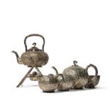 λ A CHINESE SILVER TEA SERVICE 19TH CENTURY Comprising: a kettle and cover, a teapot and hinged