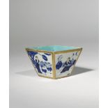 A SMALL CHINESE GILT AND BLUE ENAMEL FLARED SQUARE CUP 19TH CENTURY The exterior decorated with four