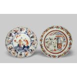 TWO CHINESE PLATES EARLY 18TH CENTURY One Imari with a fluted rim and decorated with two beauties in