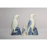 THREE CHINESE BLUE AND WHITE MODELS OF PARROTS QIANLONG 1736-95 Each depicted standing tall upon