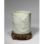 A CHINESE PORCELAIN 'LANDSCAPE' BITONG 19TH CENTURY The cylindrical brushpot decorated in relief