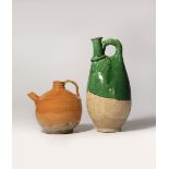 TWO CHINESE GLAZED POTTERY EWERS LIAO DYNASTY The taller vessel with an upright handle and flaring