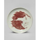 A CHINESE UNDERGLAZE BLUE AND RED 'DRAGON' DISH QING DYNASTY Decorated in copper-red with a horned