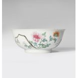 A CHINESE FAMILLE ROSE BOWL 18TH CENTURY One side painted with floral sprays, the reverse with