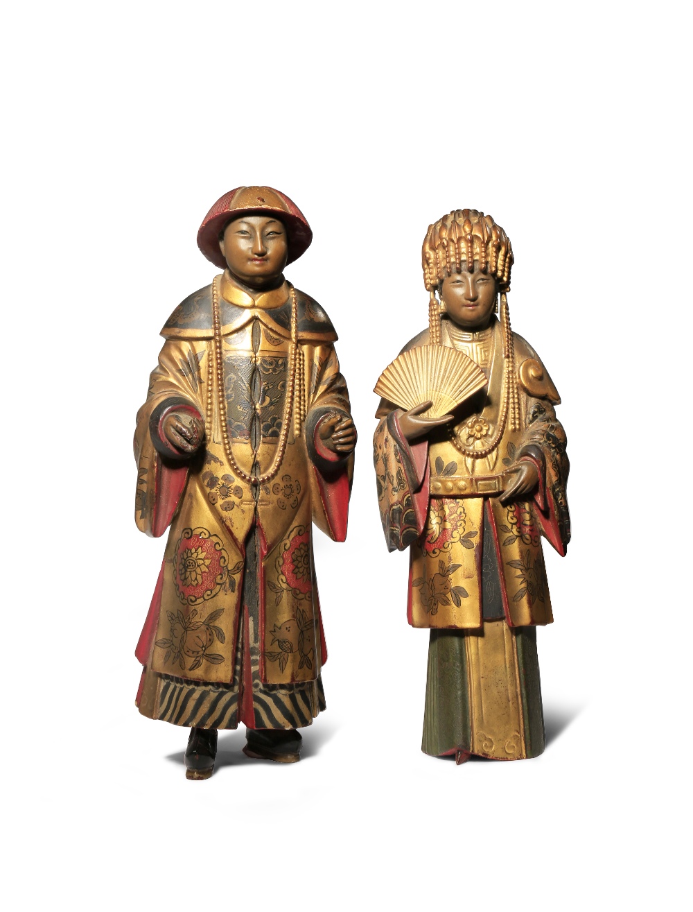 A PAIR OF CHINESE LACQUERED AND GILT-WOOD FIGURES 19TH CENTURY Depicting a gentleman and a lady,