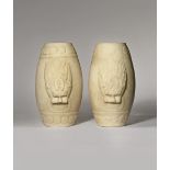 A PAIR OF CHINESE MARBLE OVOID STANDS QING DYNASTY Each carved in relief with the heads of two