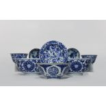 SEVEN CHINESE BLUE AND WHITE BOWLS AND A DISH 18th & 19th C. Variously decorated with flowers,