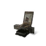 AN ANGLO-INDIAN EBONY VANITY SET 19TH CENTURY The rectangular box intricately carved to the exterior