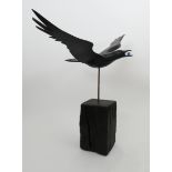 ‡ Guy Taplin (b.1939) Crow flying with an egg in its mouth Signed and titled Painted wood with glass