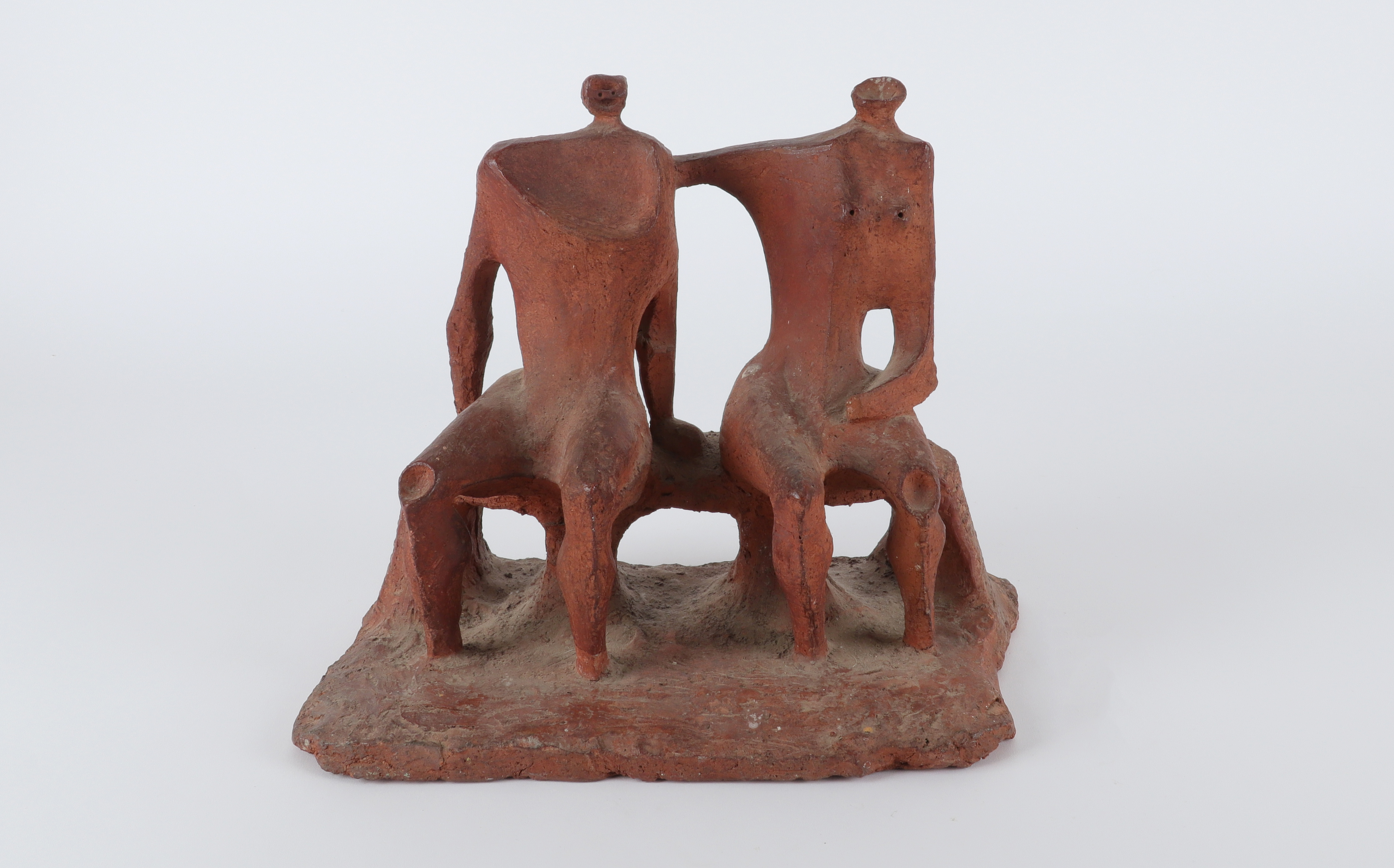 Follower of Kenneth Armitage Two figures seated on a bench Terracotta 26.5 x 29.5cm