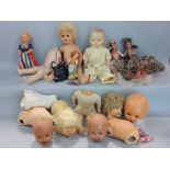 A box of various antique dolls to include heads, body parts and others