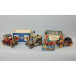 Three boxed Schuco tin plated toys together with a further tin plate toy of a gentleman in an old