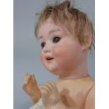 An Armand Marseille bisque head doll, mould number 500, size 6/0, 20cm approx