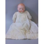 Bisque head baby doll by Armand Marseille, with soft body, closing eyes and closed mouth, size 18