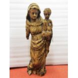 an early carved lime wood figure of Madonna and Child, 62cm high