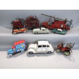 A collection of various tin plate and other die cast cars