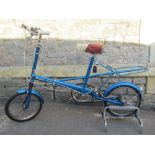 A vintage Moulton Super 4 bicycle in metallic blue colourway, Sturmey Archer four speed, together