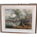 An early 20th century watercolour and body colour study of a wooded landscape with lake,