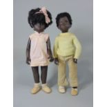 Two black Sasha dolls, boy and girl