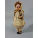 A composition doll with jointed body, no manufacturers marks, 33cm tall