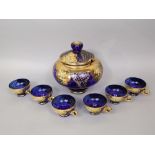 Eastern European blue glass punch bowl and glass set, with elaborate gilt and floral decoration, the