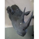 A good quality naturalistic life size hollow composite rhino head with glass eyes