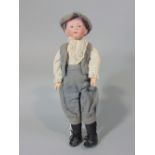 A Gebruder Heubach bisque headed boy doll mould 6894 with closed mouth, jointed limbs, grey