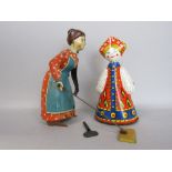 D.R.P.A German 'Busy Lizzie' wind up tin plate toy, together with a further wind up tin plate toy (
