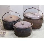 Three Kenrick & Sons oval cast iron cooking pots and covers, 6-4-and 3 gallon examples