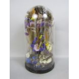 Victorian diorama of butterflies amidst flowers, under a glass dome with ebonised plinth base,