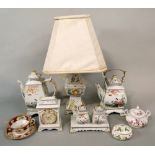 A collection of decorative Franklin Mint ceramics including a lamp base, a mantel clock, a tea pot