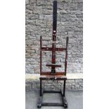 A Victorian oak artists easel by Reeves & Son, the telescopic framework positioned on a central