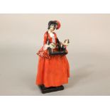 A Royal Doulton figure of The Sketch Girl designed by Leslie Harradine and made for the Sketch