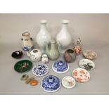 A quantity of oriental ceramics including a celadon glazed coffee pot with relief moulded flying